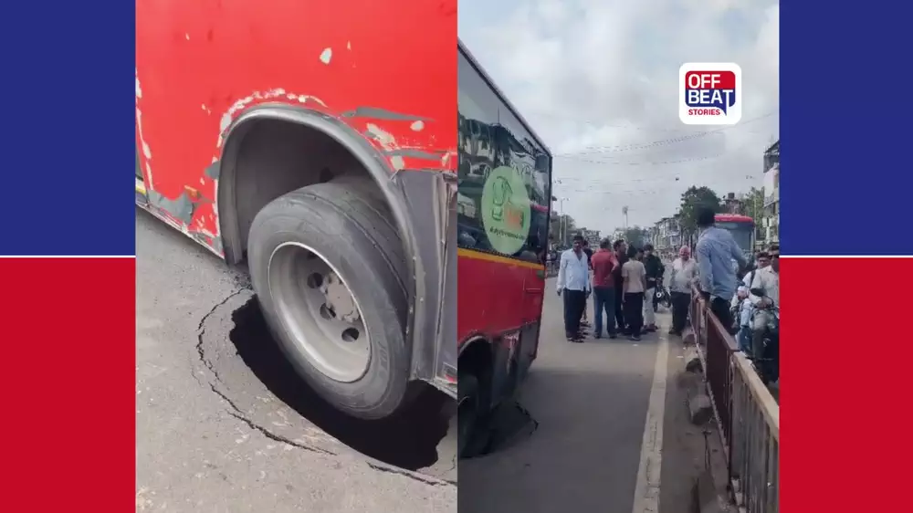 સુરતમાં BRTS બસ રસ્તામાં પડેલા ભૂવામાં ફસાઈ