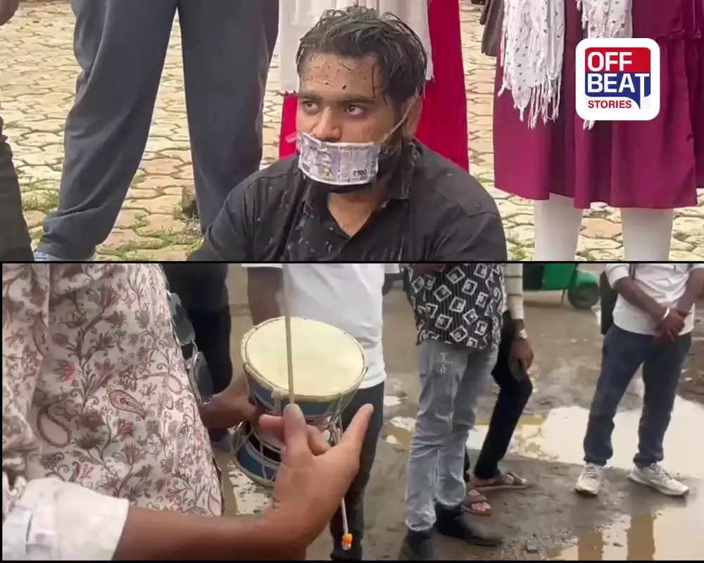 મોઢા પર રૂપિયા અને હાથમાં ડમરુ!